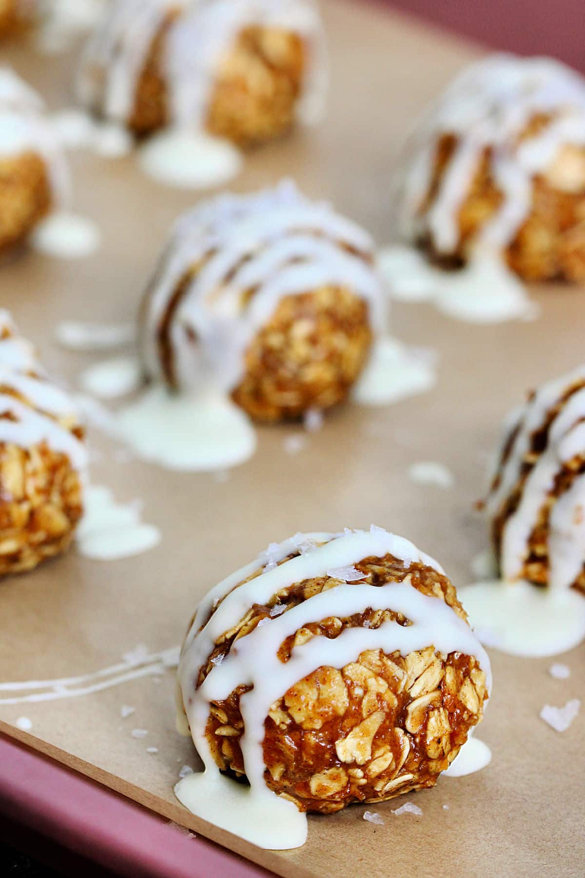 Pumpkin protein balls on a sheet pan.
