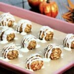 Pumpkin protein balls on a sheet pan.