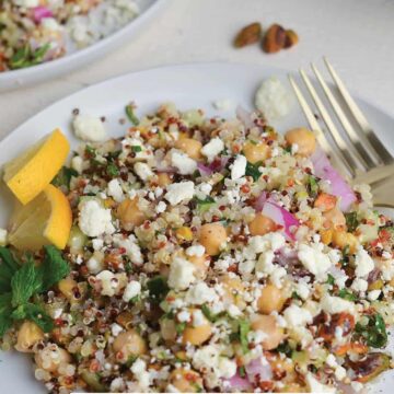 Jennifer Aniston salad on a white plate with a fork.