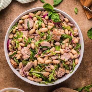 Italian tuna and white bean salad in a white bowl.