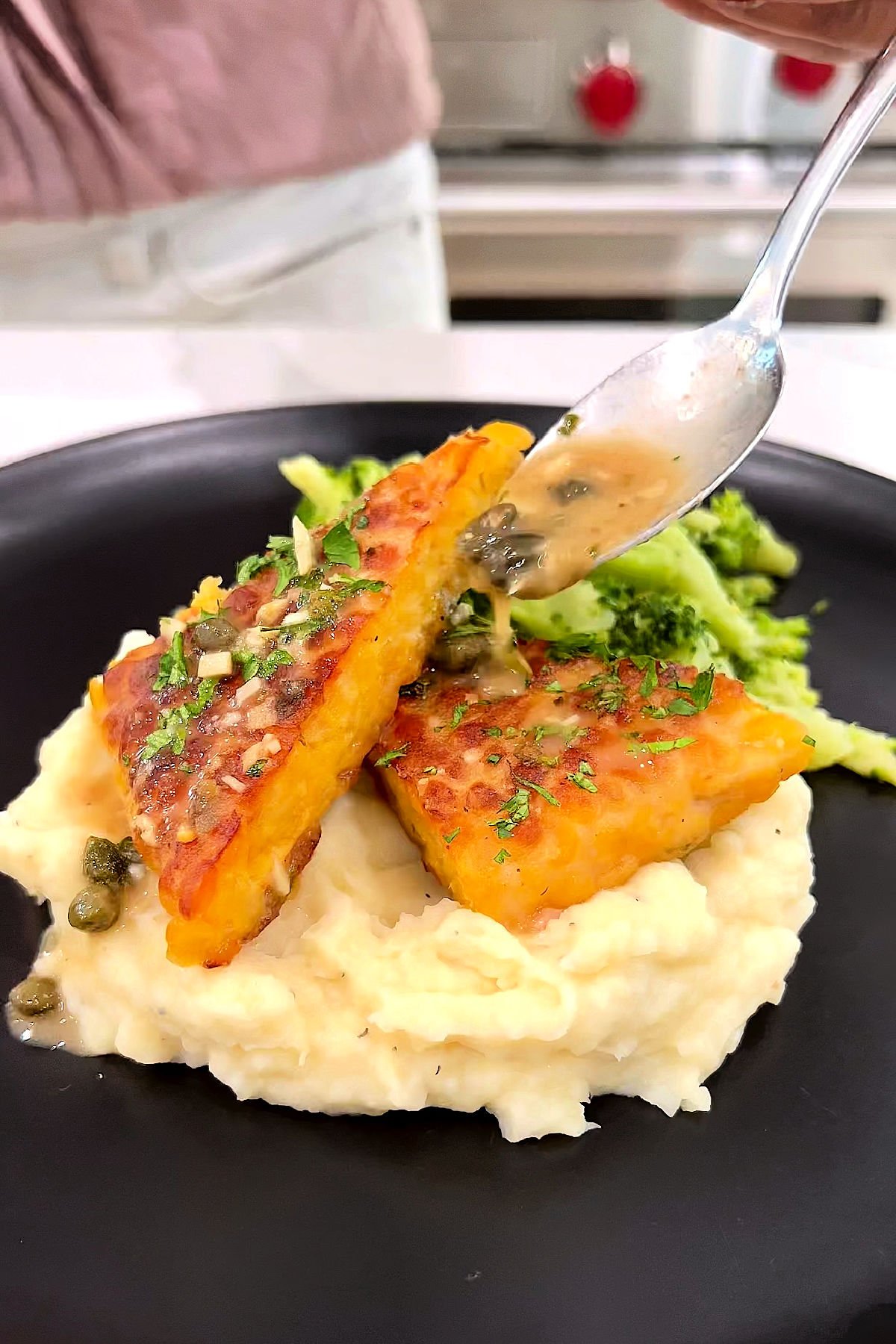 Plated vegan piccata with tempeh, mashed potatoes, and broccoli – plant-based comfort food dinner